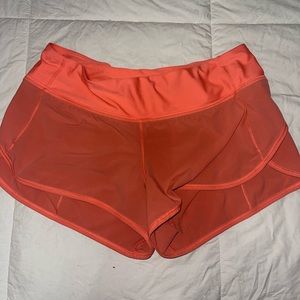 Pink Lululemon run speed shorts